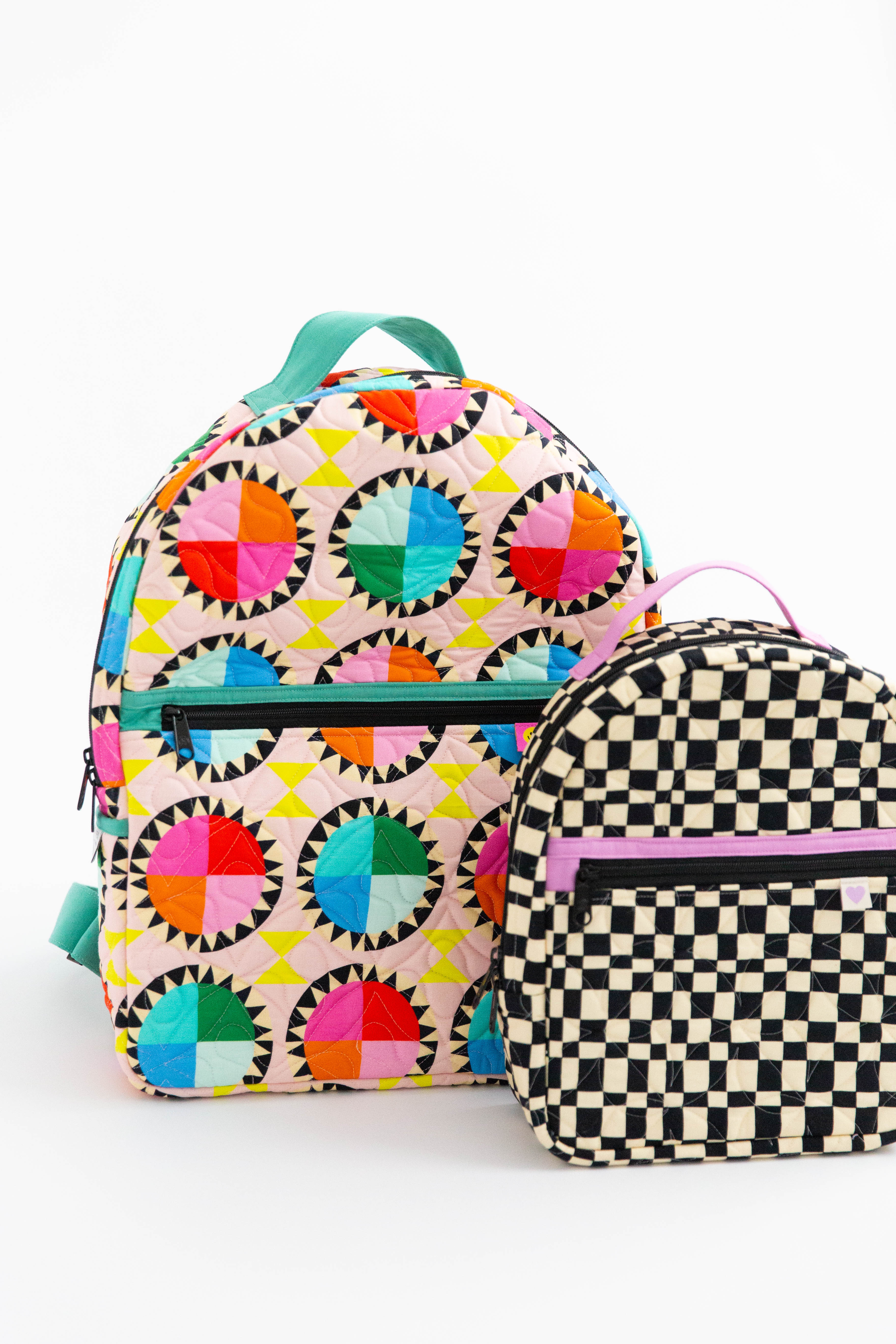 The Archie Backpack (large bag) and the Violet Backpack (small bag)